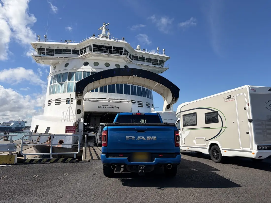 Cars and a motorhome driving up the ramp onto the Delft Seaways