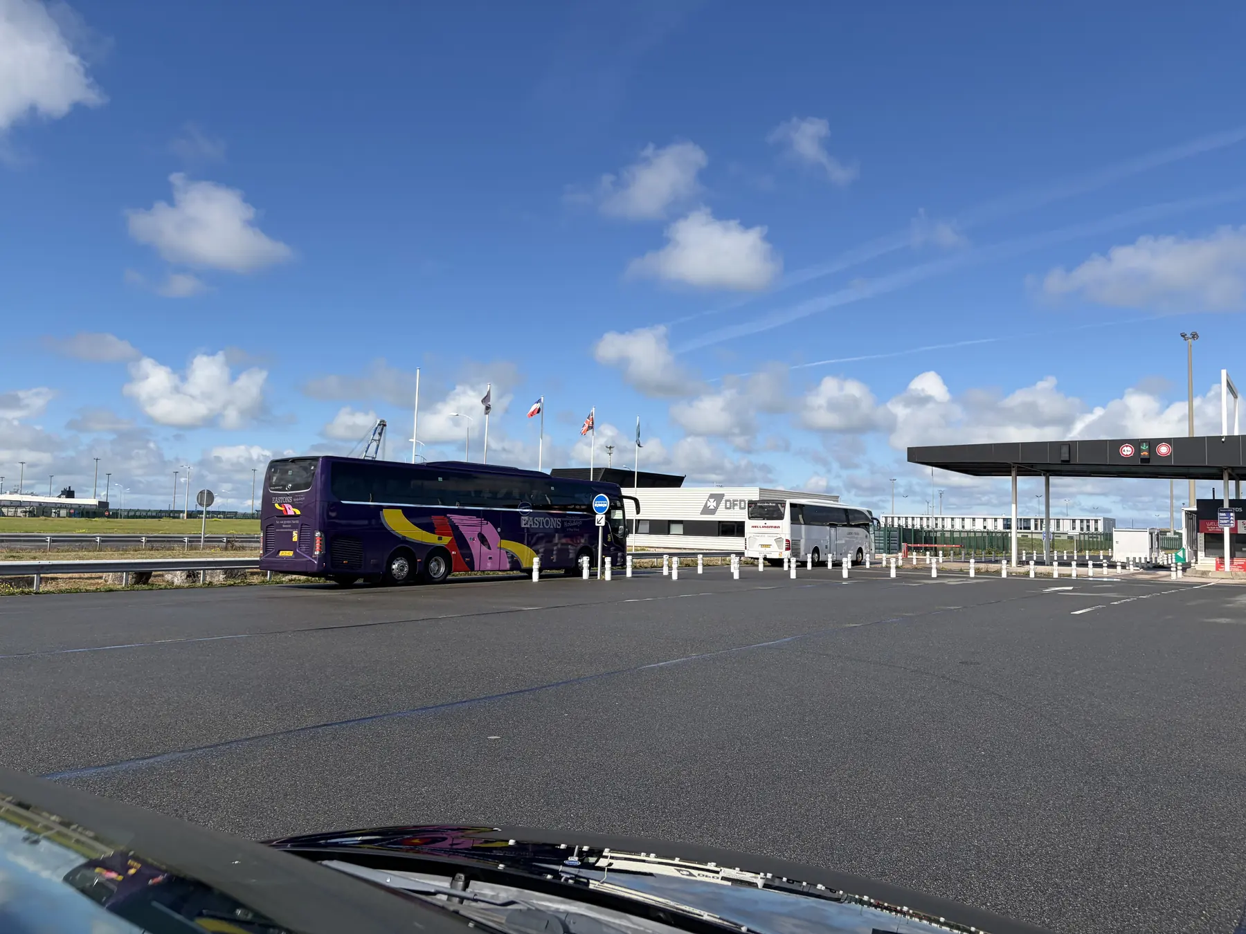 The DFDS check-in booths at Loon-Plage with coaches in the left lanes